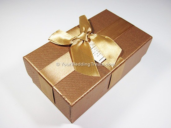 gold cardboard favor box with ribbon message