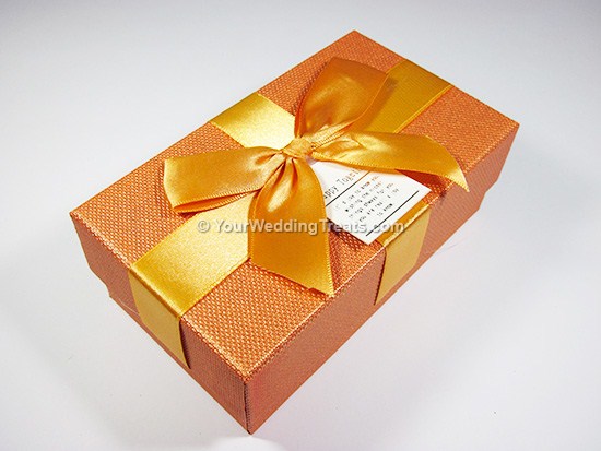 orange cardboard favor box with ribbon message
