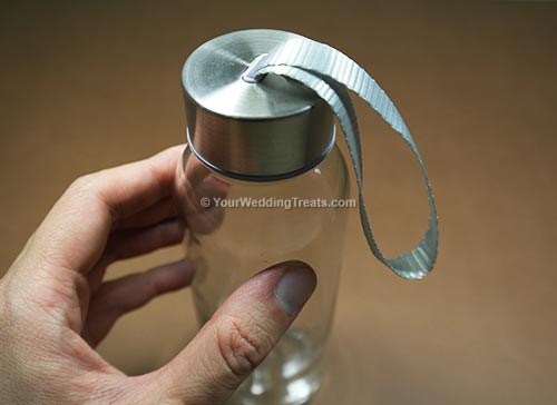 wedding favor long glass bottle with silver cover